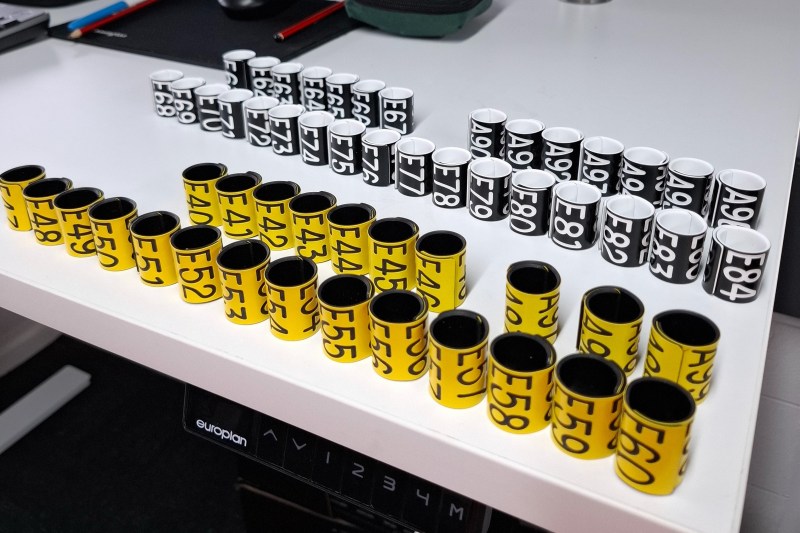 Numbered film canisters arranged on a table.